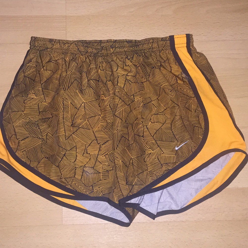 Orange Nike athletic shorts